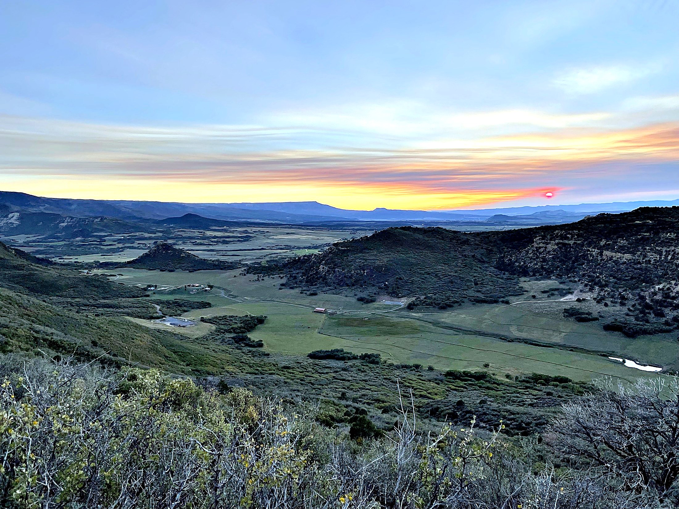 Carlog Cattle Co. ranch — Colorado high-country valley at sunset